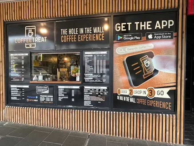 Coffee Treat's hole-in-the-wall shopfront with a Get the App panel: Order, Drop in, Go